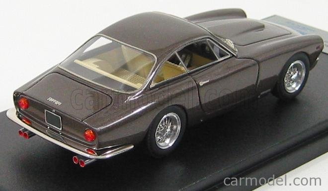 Bonhams : A photograph depicting Steve McQueen with a Ferrari Lusso