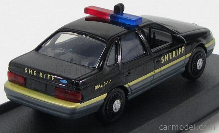 Motormax 1/43 1986 Ford Taurus LX Sheriff Police Car w/ Display Case 73845 