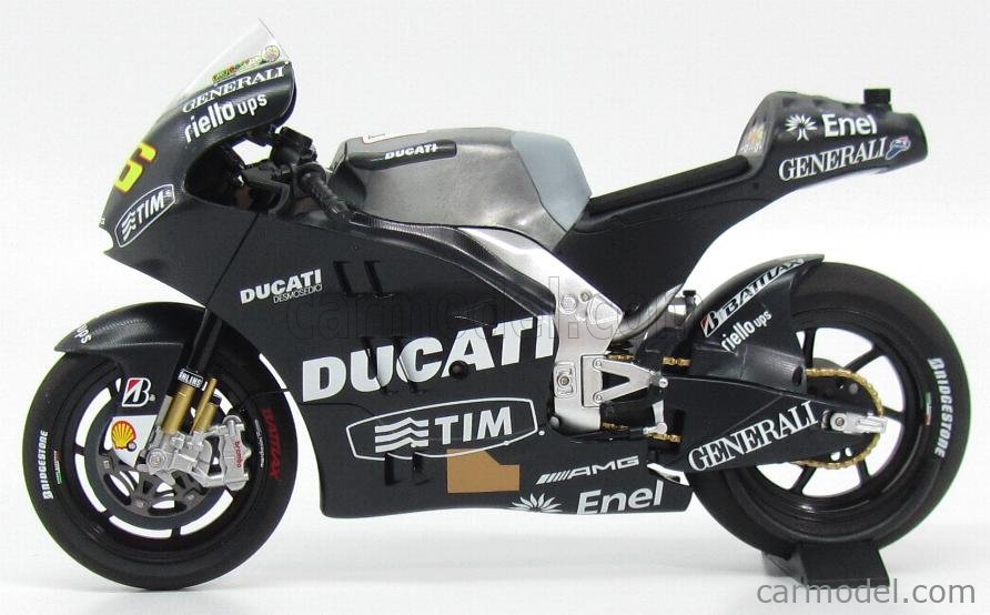 FIGURINE of VALENTINO ROSSI DUCATI TEST MOTOGP STARTING STANCE ON BIKE in  1:12 Scale by Minichamps